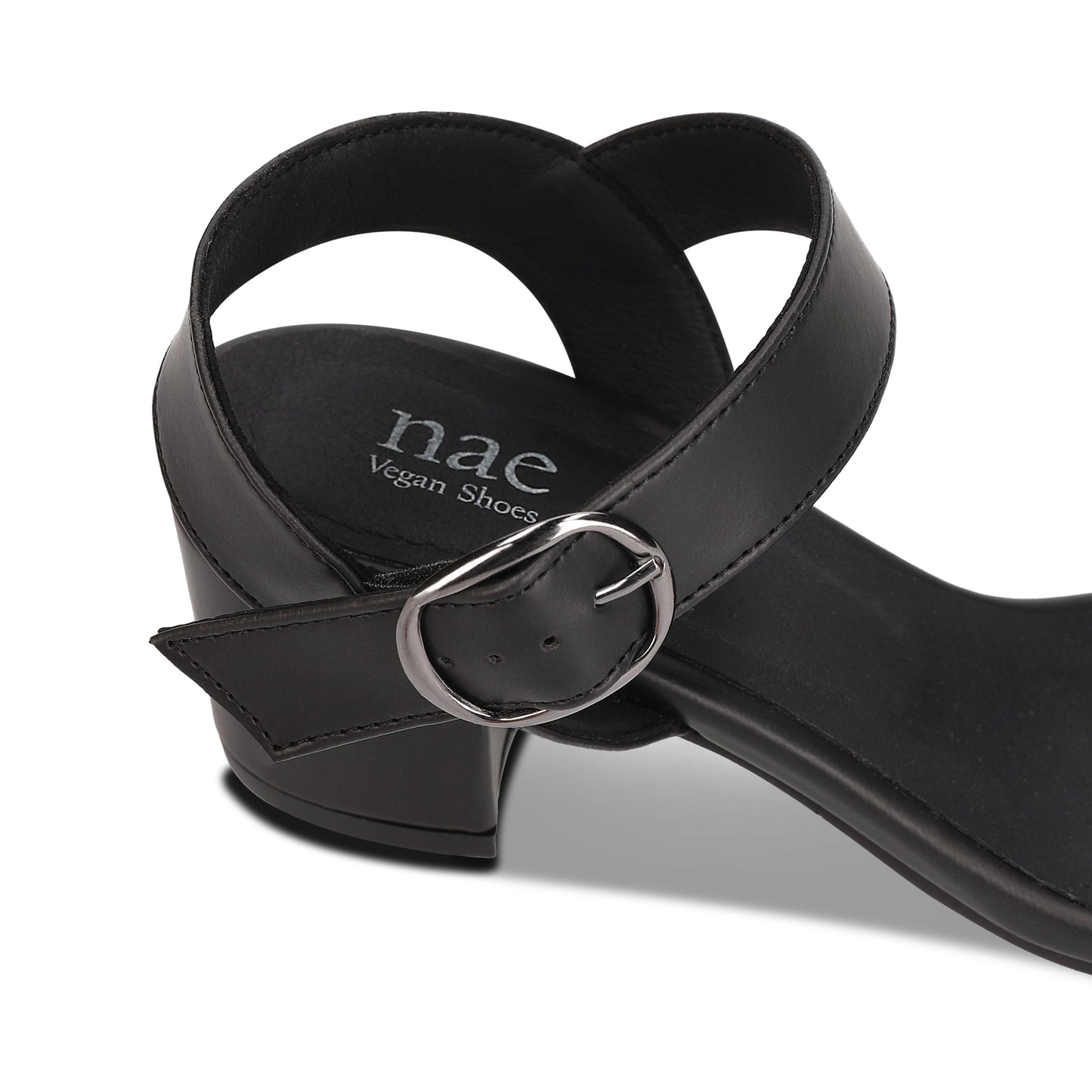 vegan heels with ankle strap buckle and NAE Vegan Shoes logo on the insole