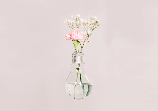 recycled light bulb in a flower vase