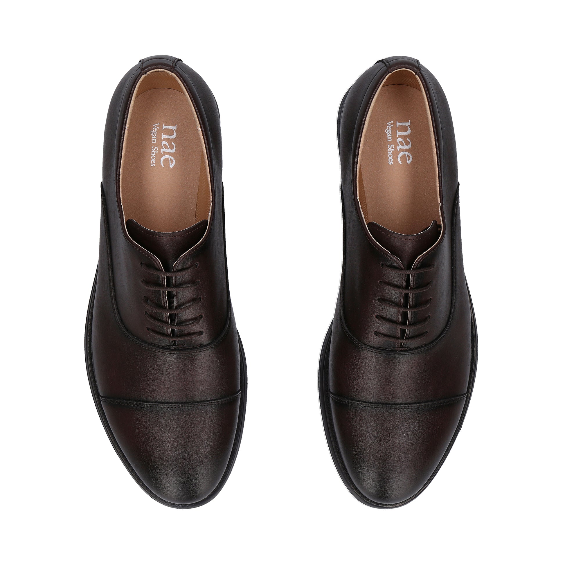Pair of brown leather shoes with 'nae' branding on a white background