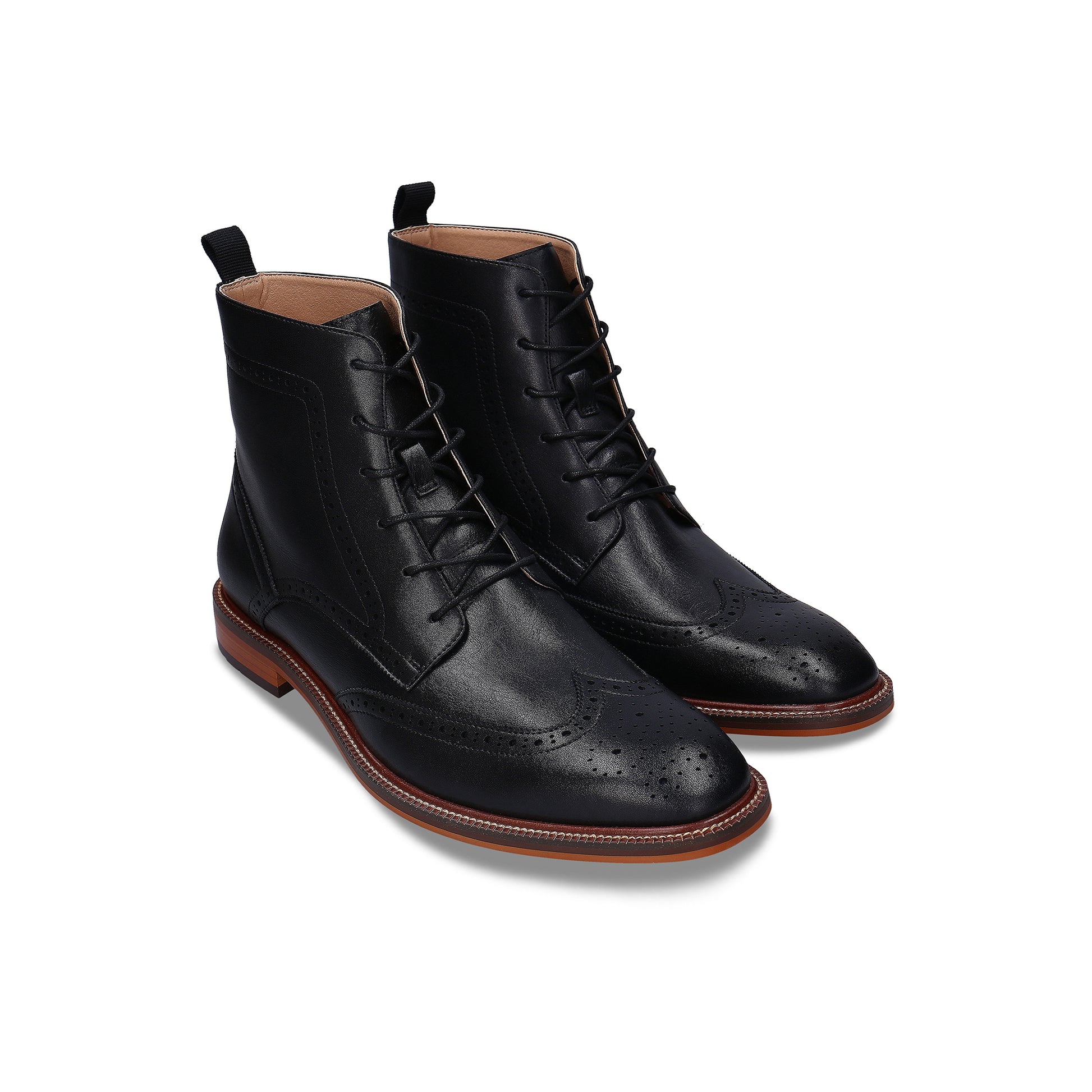 Pair of black leather dress boots on a white background