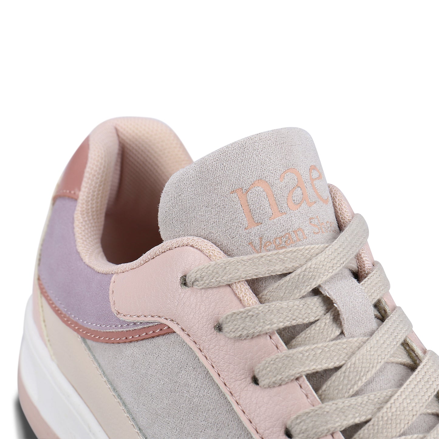 close view of logo on the tongue and collar padded on the NAE's vegan trainers | NAE Shop