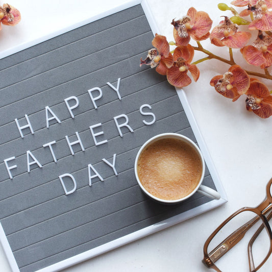 NAE Vegan Shoes Father's Day Gift Card - coffee and orchids flat lay