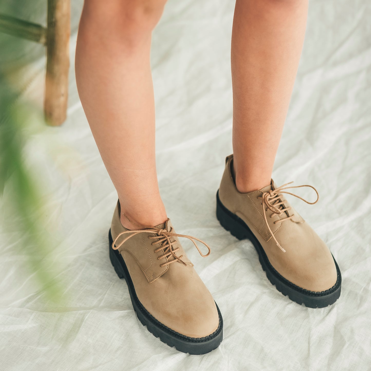 Wearing women derby flats in beige microfiber from NAE Vegan Shoes