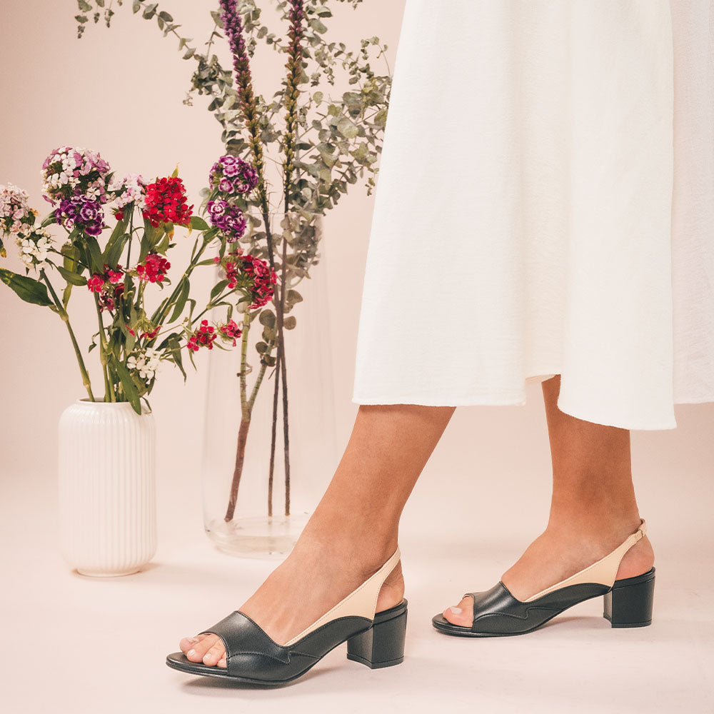 Women wearing vegan slingback heels with white dress | NAE Footwear