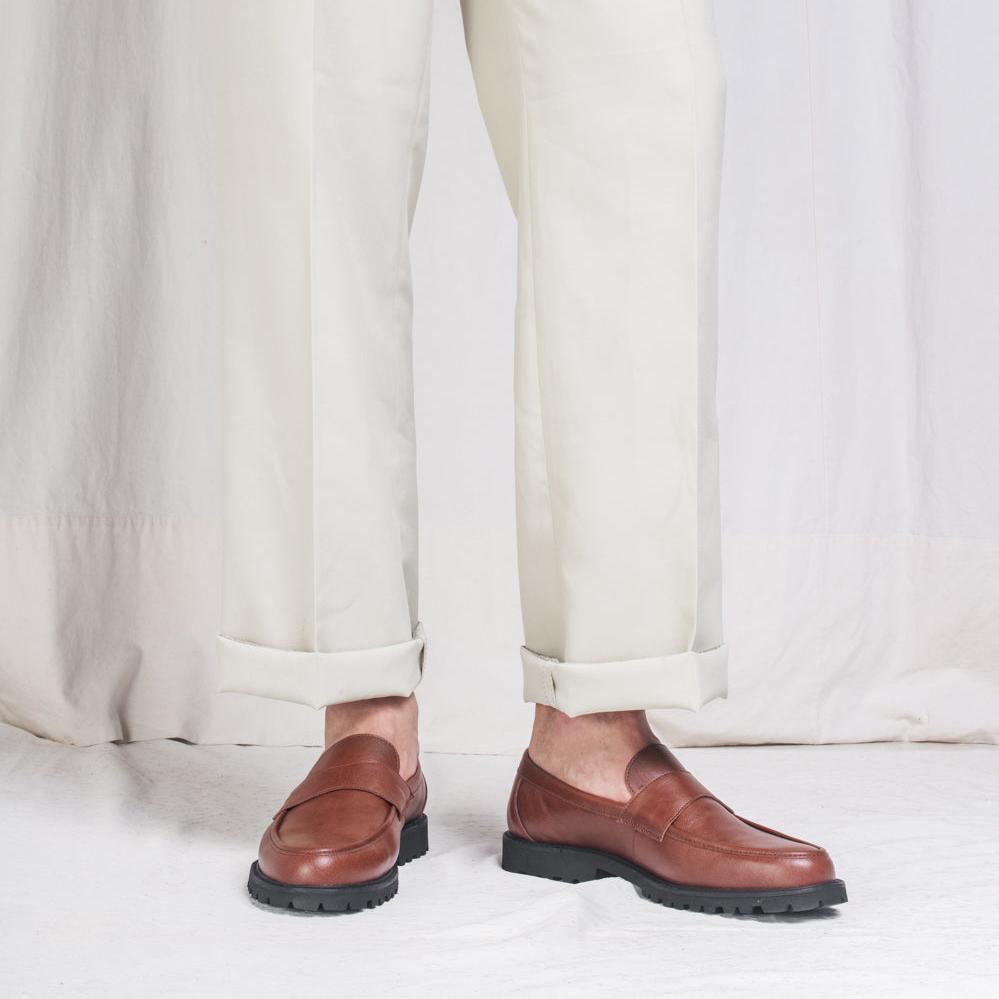 Brown vegan loafers wearing white casual pants | Ethical fashion from NAE Vegan Shoes