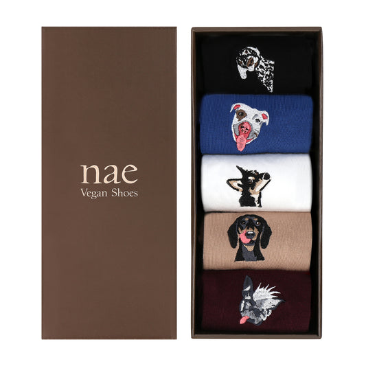 Set of socks with dog illustrations in a box labeled 'nae Vegan Shoes'.