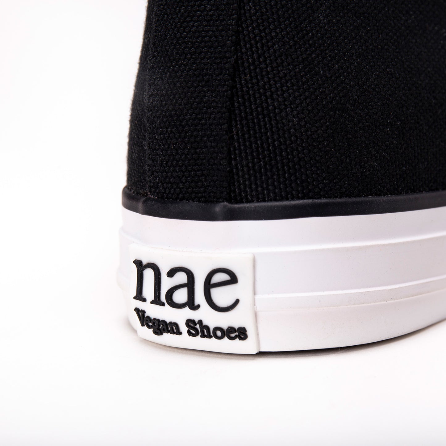 logo engraved on the back of the sole of a vegan trainer made with cotton | NAE Vegan Shoes