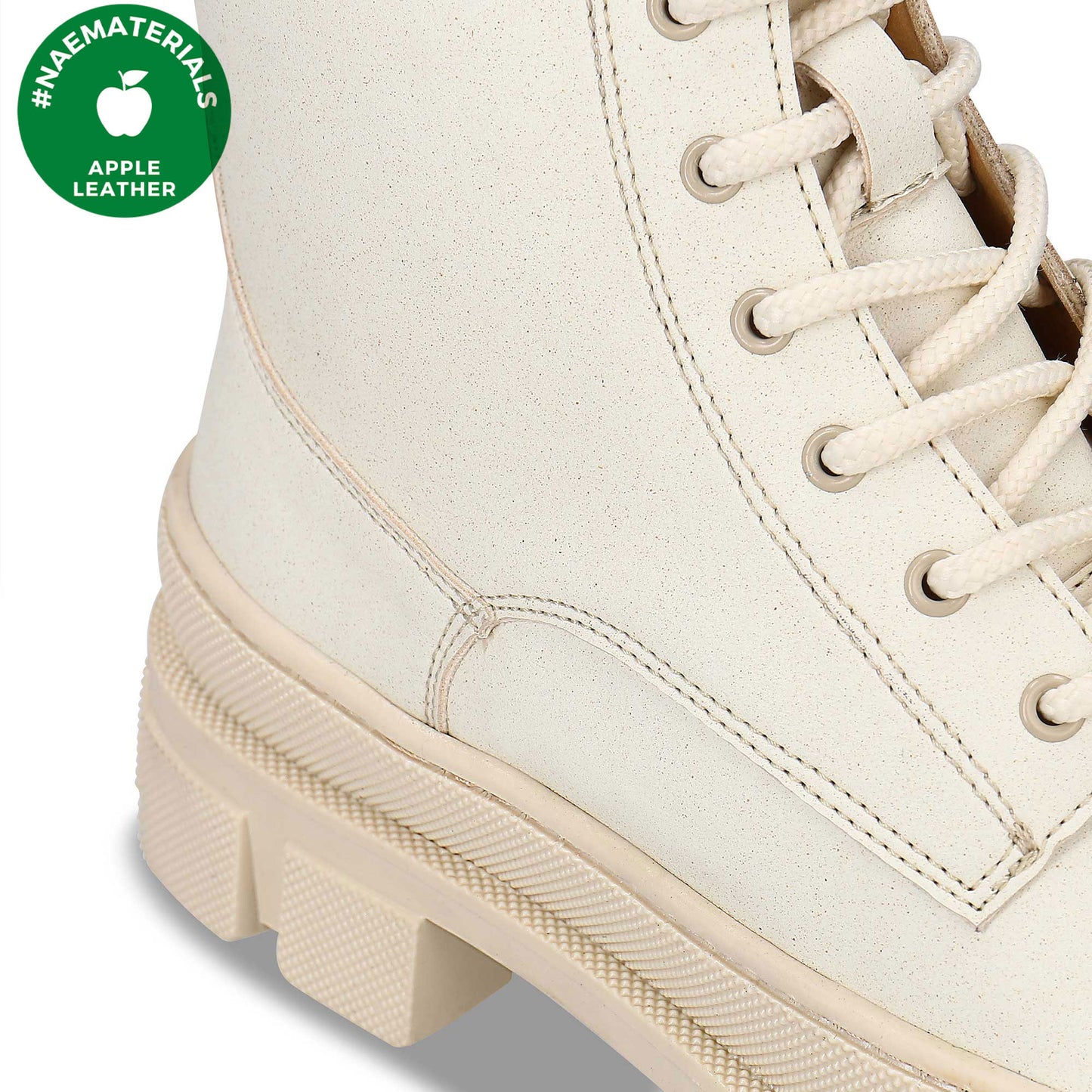 close view of white ankle boots for women with zip and laces | NAE Materials label