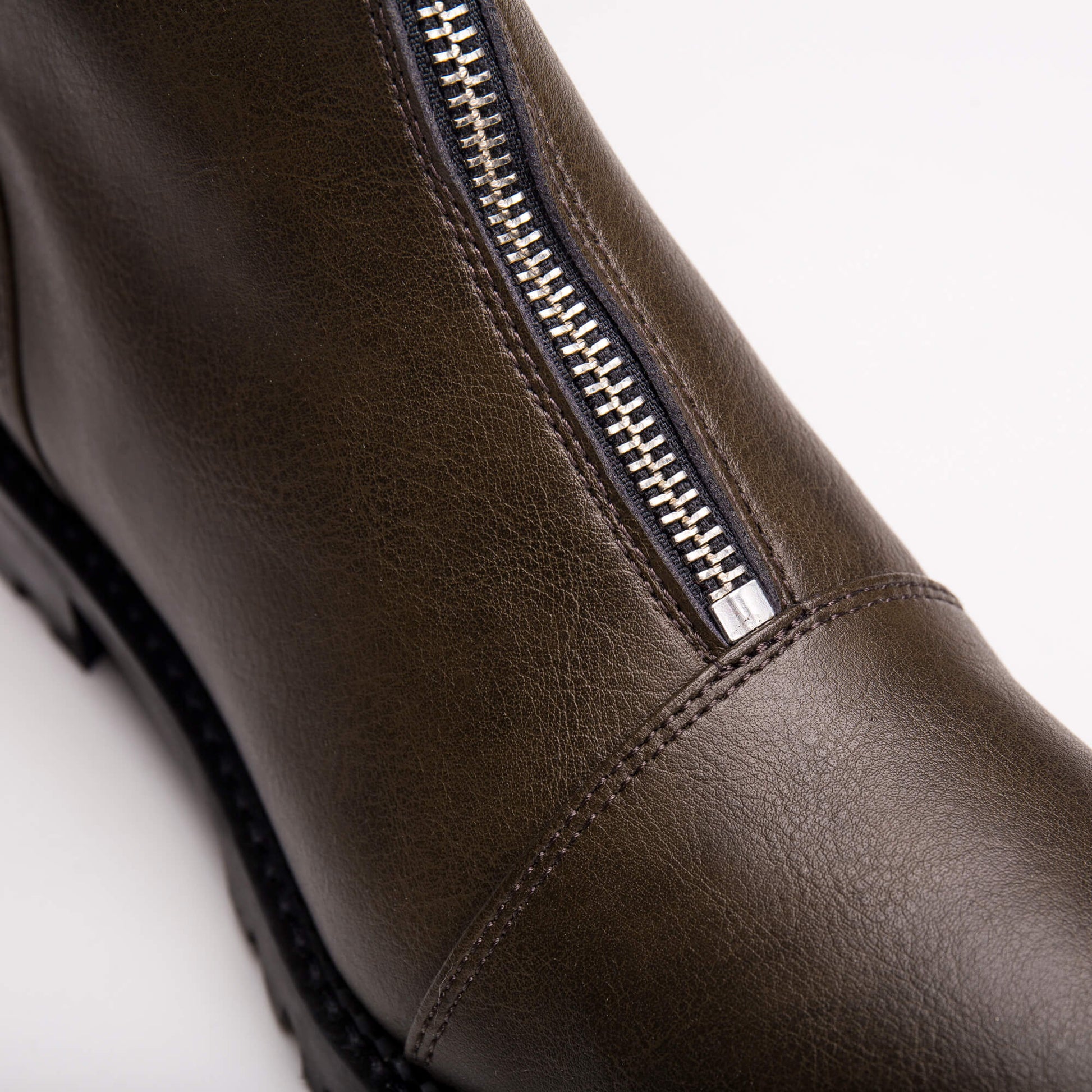 close view of zip up from vegan ankle boots | NAE Shop